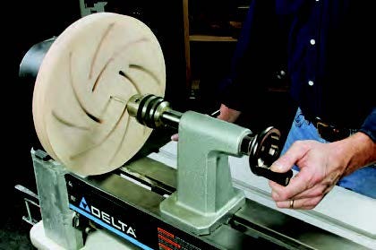 Longworth bowl chuck attached to the lathe for drilling