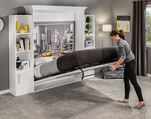 woman opening a murphy bed