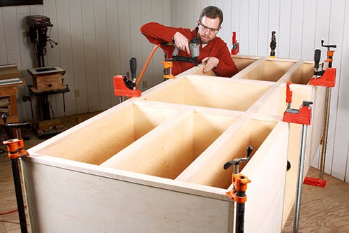 Attaching face frame to cabinet body with nail gun