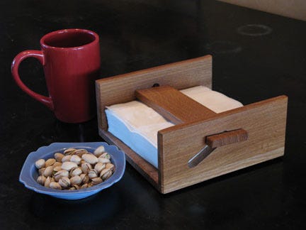 White oak napkin holder displayed on a table