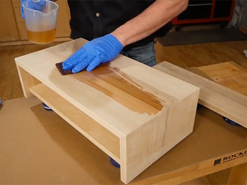 applying Danish oil finish to wood drawer frame