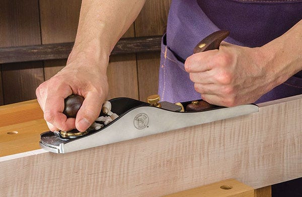low-angle jack plane smoothing the edge of a board