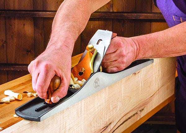 NO. 7 jointer plane smoothing the edge of a board