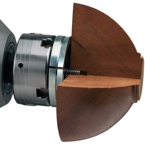 Nova four jaw chuck with bowl blank cut away to show attachment