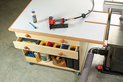 Outfeed table storage drawers