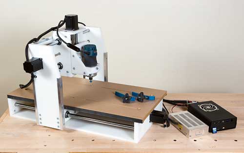 CNC routing system with its various bits and computer parts displayed