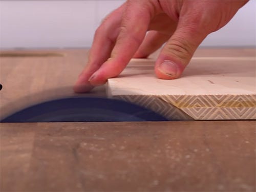 Cutting a plywood panel with a decorative edge