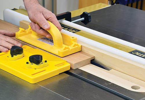 Microjig push block guiding a rabbet cut on a table saw