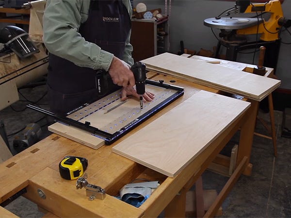 using a jig to drill shelf pin holes for cabinets