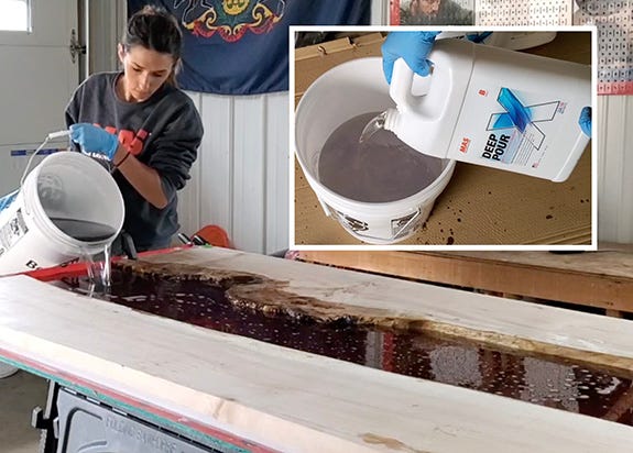 pouring epoxy to make a river table