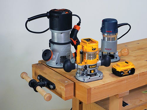 Selection of three different types of router on a workbench