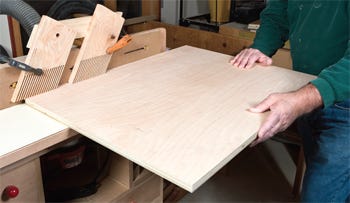 Cutting rabbet in cabinet base with router