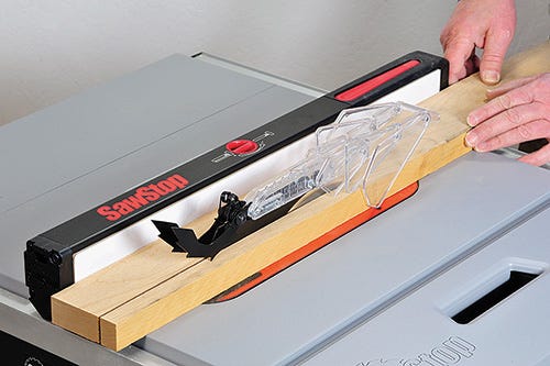 Sawstop blade guard with dust collection and anti-kickback pawls