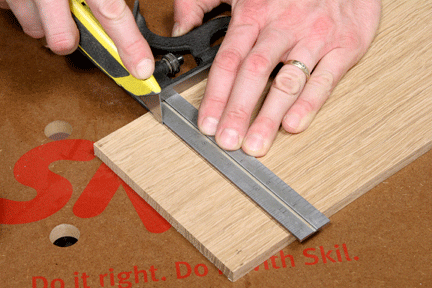Marking miter cut with a razor blade
