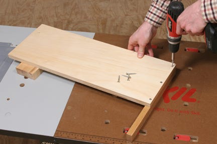 Attaching crosscut jig fence to base with screws