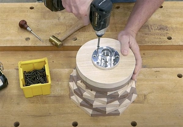 Gluing the bottom round piece and a scrap piece of Poplar to the bottom of the stacked frames and attaching faceplate to the poplar.