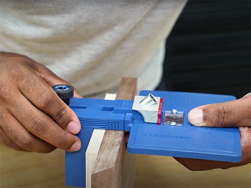 Placing corner key doweling jig to drill joinery