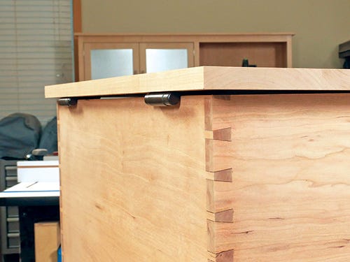 Lid stay torision hinges recessed in mortise cut in chest casework