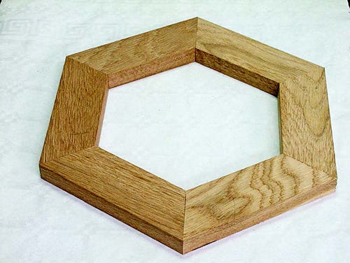 Six sided frame with angles cut using a miter cutting sled