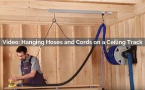 hanging hoses and cords on a ceiling track video screenshot