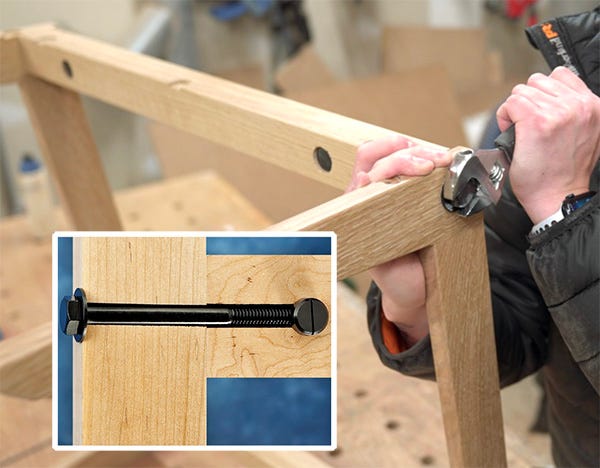 tightening cross dowel bolts to assemble a table