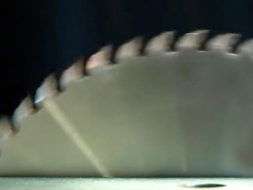 Close-up of a table saw blade in motion