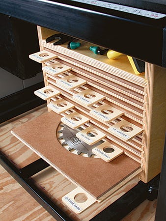 Assembled saw blade storage cabinet and trays