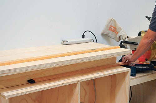T-track slots in miter saw cabinet tabletop