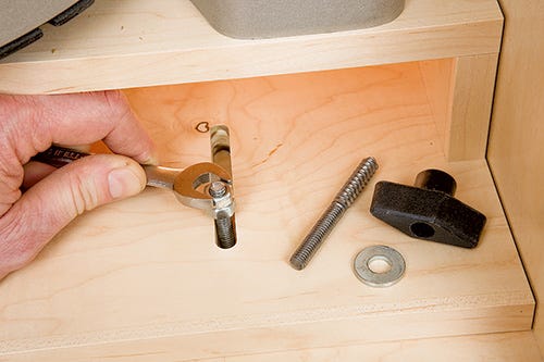 Tightening movable hanger bolts inside miter saw platform