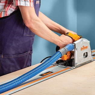 Dust collection hose on a triton track saw