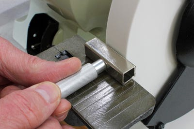 Cleaning grinding wheel with a dressing stick