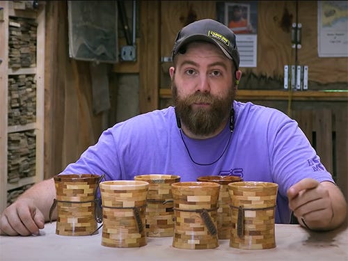 Paul Jackman with six pallet wood candle holders