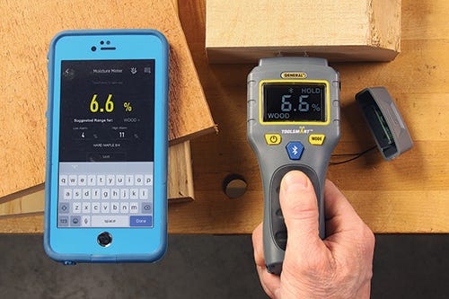 Checking the moisture content of a piece of lumber
