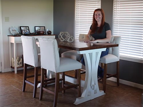 April Wilkerson shows off her 8/4 walnut tabletop