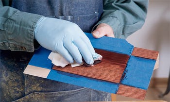Using a shop rag to spread stain