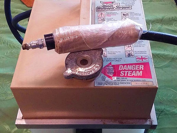 Tube and nozzle for distributing steam onto wood