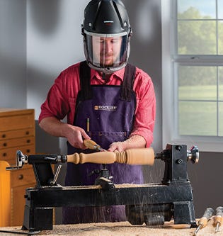 Turning with a face mask and apron