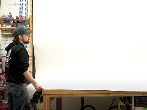 Michael Alm rolling out photo shoot background
