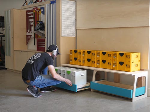 Chris Salomone testing out his workshop storage system