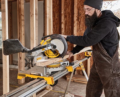 man using dewalt saw