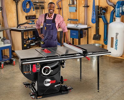 Man psoing with a table saw