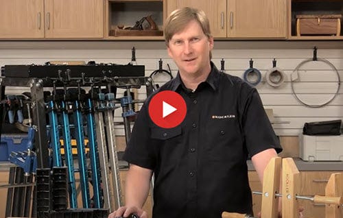 Man standing by Clamp Rack