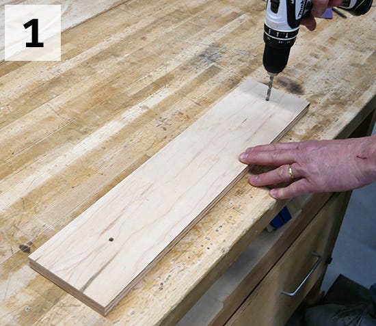 man drilling end holes for post channel