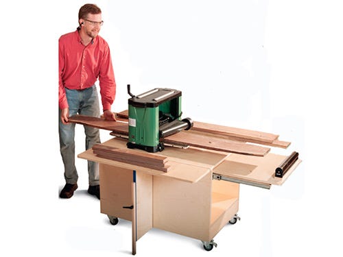 Plywood shop table with foldout outfeeds for planing wood