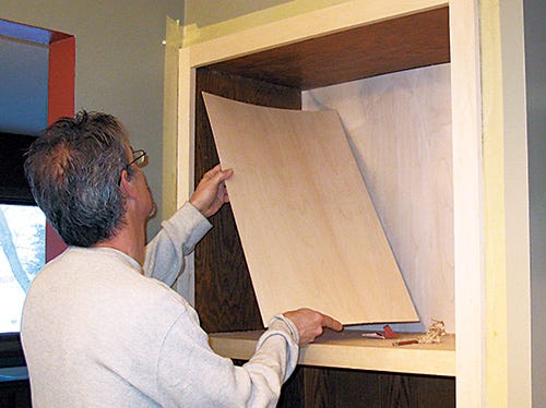 Reinstalling shelf in upper chamber of storage cabinet