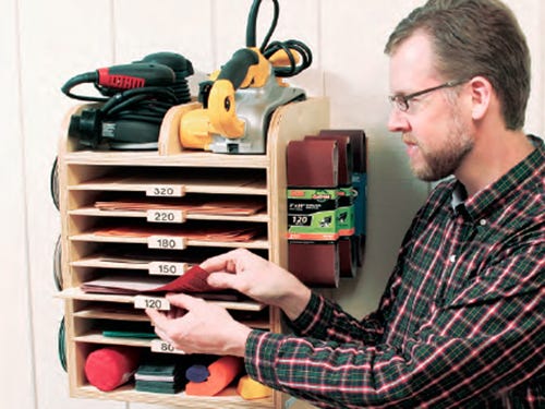 Wall mounted storage system for sandpaper